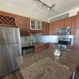 kitchen with ample counter-space, modern appliances and bright lighting